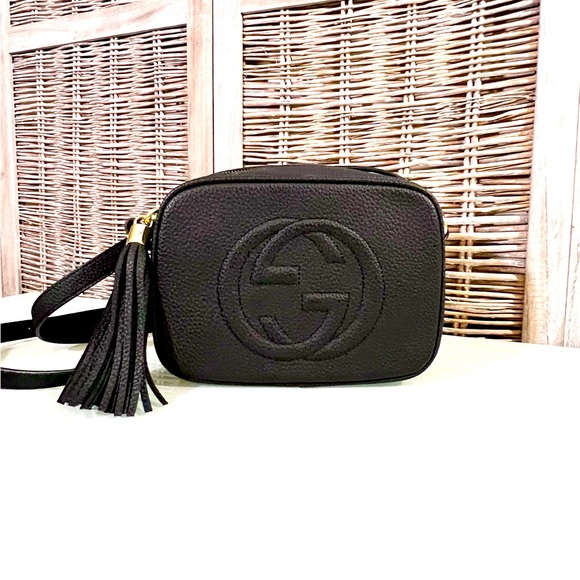 Black Shoulder Crossbody adjustable strap. Imprint on front. Gold zip closure. - Picture 1 of 9